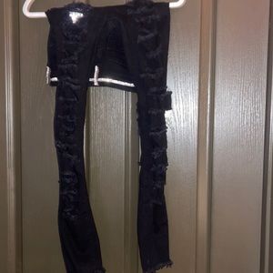 Black mid rise ripped jeans with rhinestones